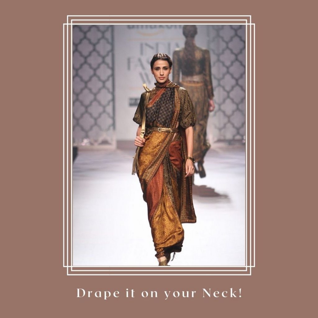 Another modern twist to the saree is this fabulous style that requires the pallu of the saree to be draped in a thin layer around the neck, almost like a  dupatta.